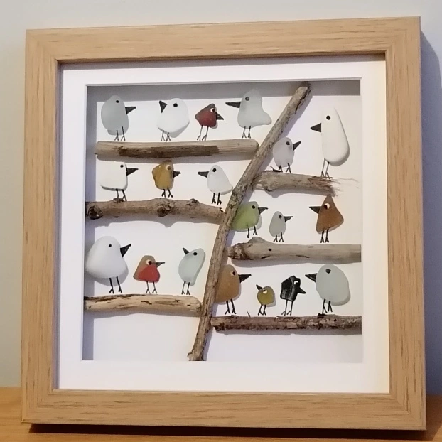 Sea glass birds on a driftwood tree - picture in an oak frame